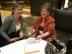 Ane Mulligan signing contract